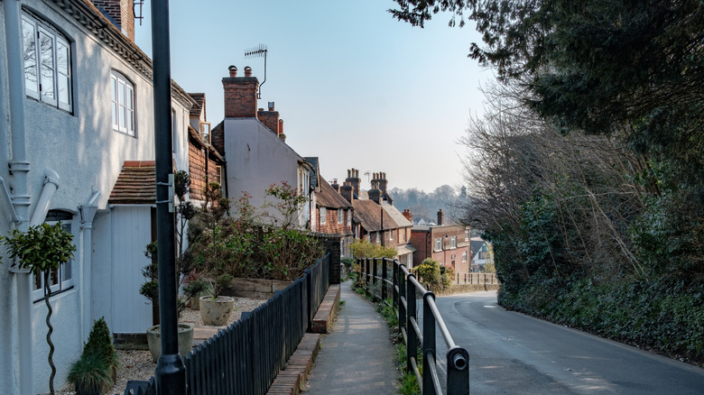 A sloping street with brick buildings in Haslemere, England
