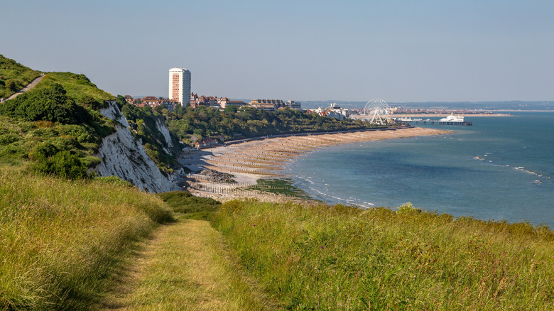 Coastal cliff pathway with a view of Eastbourne in the distance