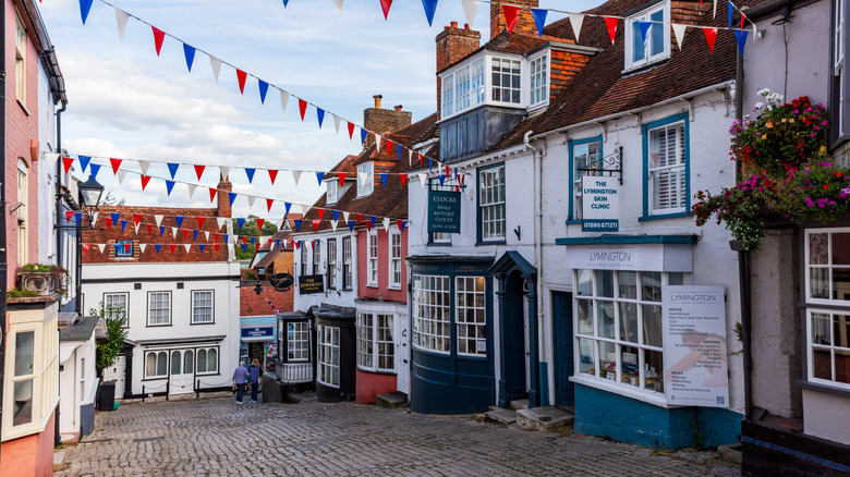 Rows of shops on a cobbled street in Lymington, England