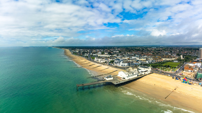 Aerial view of Bognor Regis town, pier, and beach on sunny day