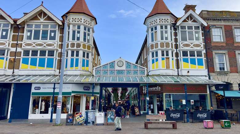 Clock and colorful historic buildings of Bognor Regis arcade