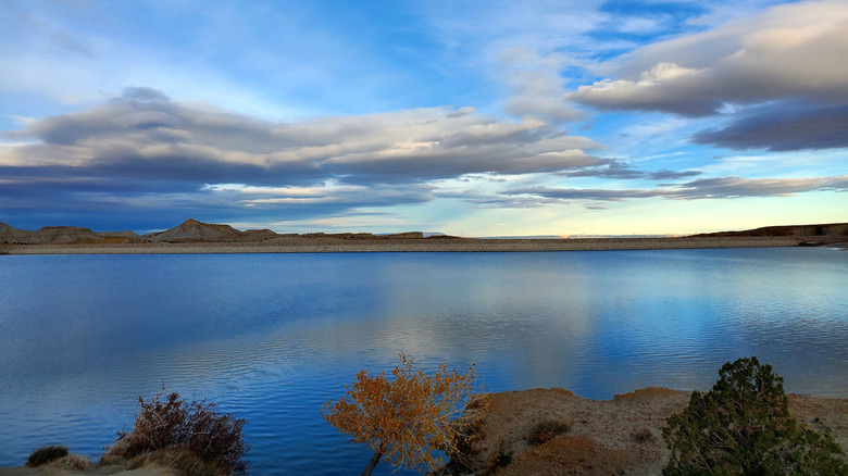 Clouds reflecting on waters of Millsite Reservoir in Millsite State Park, Utah