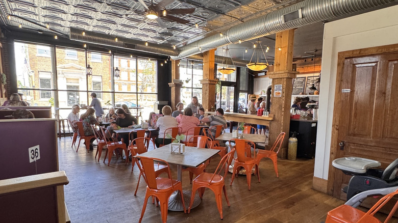 Diners sitting at tables inside Curtsy's Cafe & Burger Bar in Franklinton, North Carolina