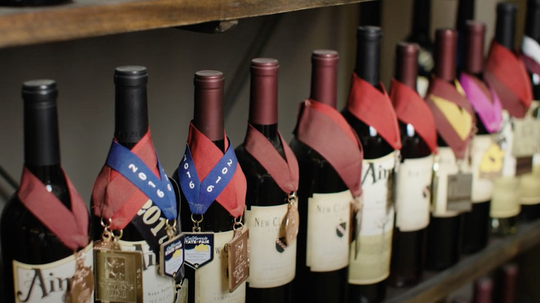 A row of wine bottle with awards on them at New Clairvaux Abbey in Vina, California