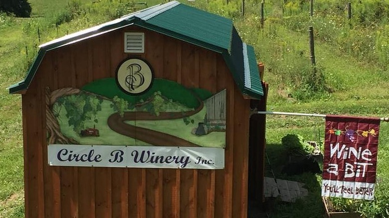 Sign for Circle B Winery Inc on a wooden hut.