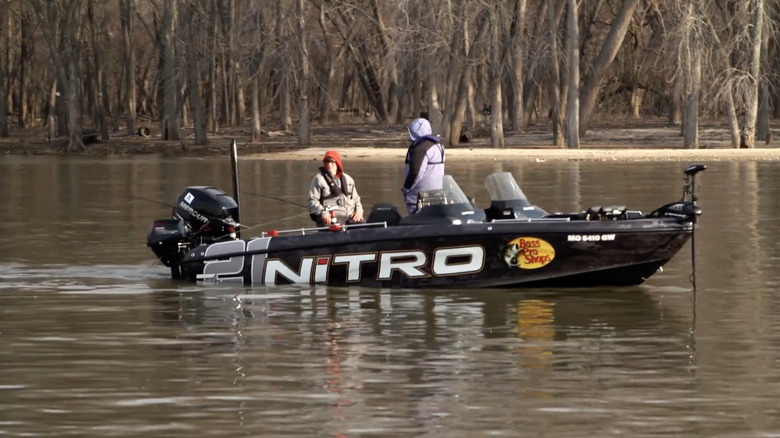 Two men fishing from motor boat