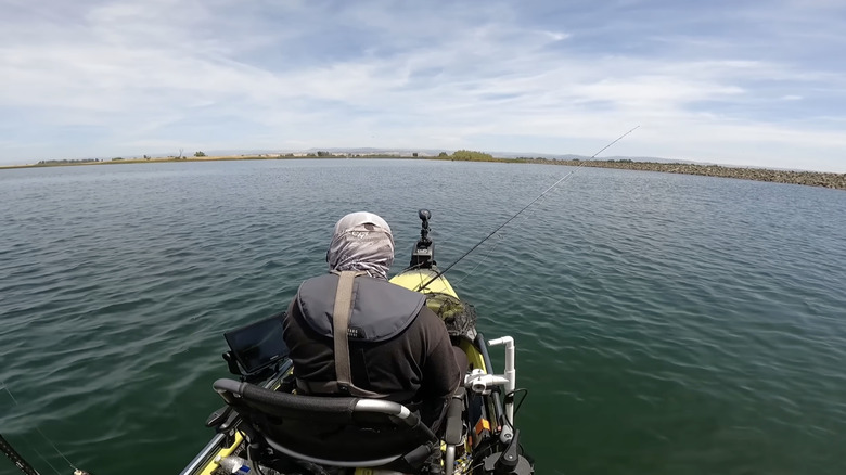 Over-the-shoulder shot of fisherman on Afterbay