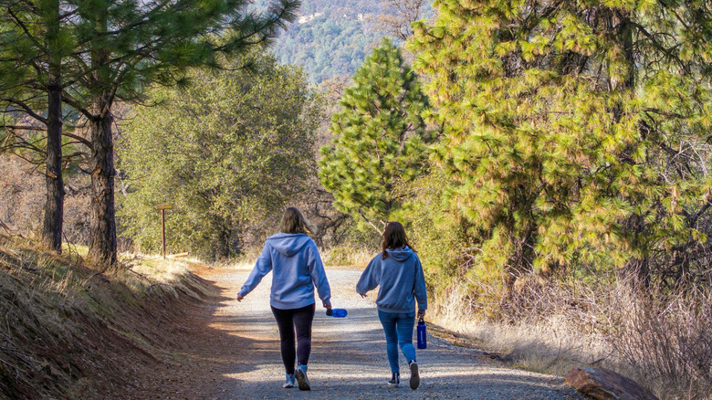 Two people on a trail at Hidden Falls Regional Park in Auburn, California