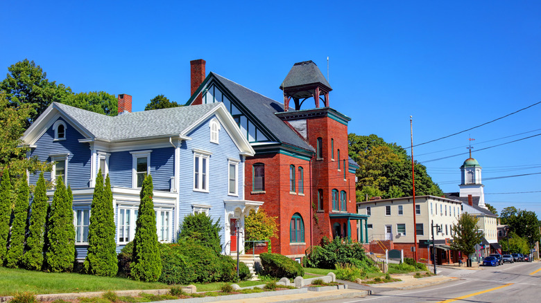 Historic homes in Somersworth along a road surrounded by green trees