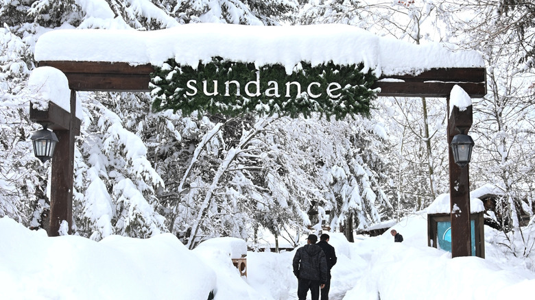 Men walking into the snowy Sundance Mountain Resort in Utah