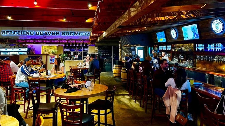 Patrons dining and drinking at Belching Beaver Brewery Tavern & Grill in Vista, California