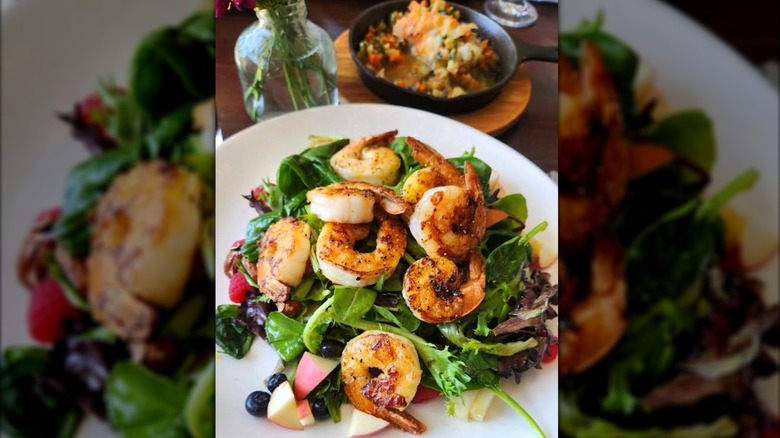 Grilled shrimp on a bed of vegetables at The Waterfront Grill & Cafe, restaurant in Pittsburg, California