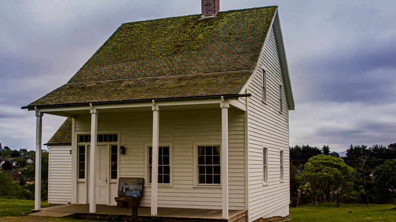 A historic building at Fort Humboldt State Historic Park on a grassy lawn.