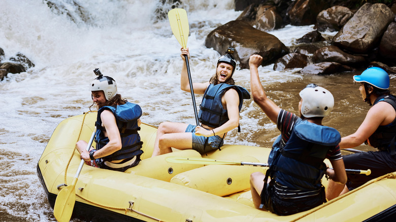 A group of friends white water rafting