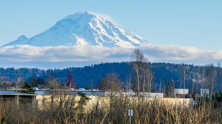 The snow-dusted slopes of Mt. Rainier rise over Auburn, Washington