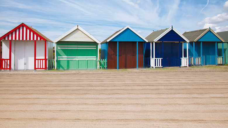 Colorful beach huts lining the white sands of Sutton-on-Sea Beach