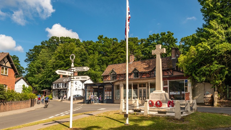 Downtown Burley with a Celtic cross, signpost, and shops