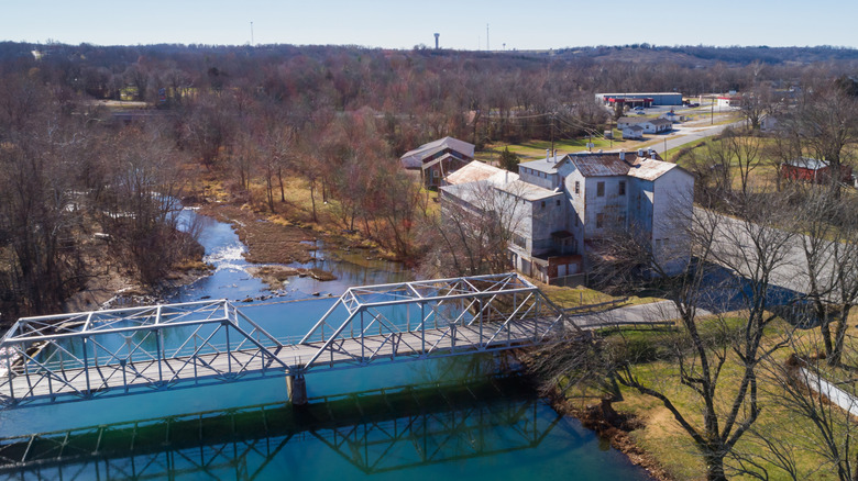 An aerial view of the town mill and a bridge in Ozark, Missouri, both of which lie along the Finley River.