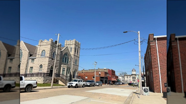 More old brick buildings from downtown Jackson, with a three-story church and shorter red-brick downtown buildings