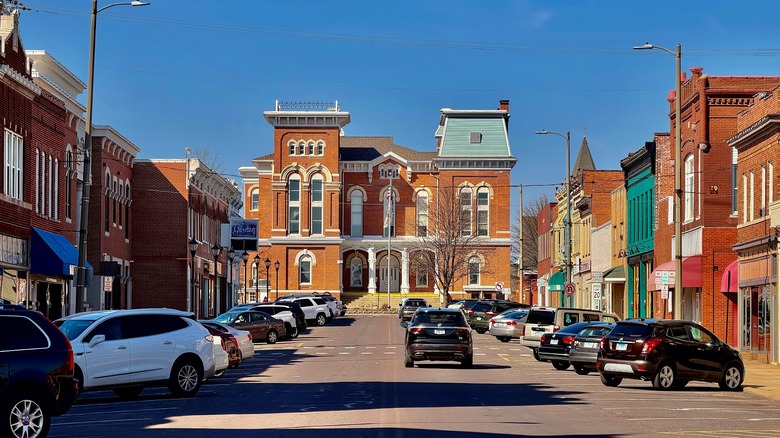 Downtown Hillsboro with two-story brick buildings on either side of the street and the historic courthouse at the end