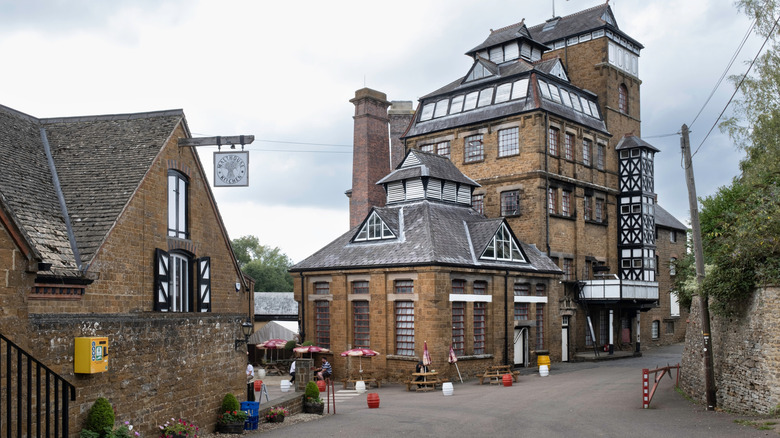 The Hook Norton Brewery tower in Oxfordshire, England as seen from the street.