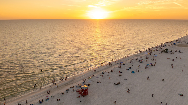 The sun sets in the Gulf over Siesta Beach.
