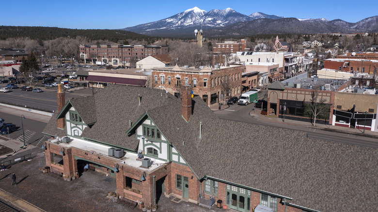 An aerial view of Flagstaff, with skiable mountain terrain in the distance