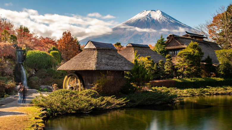 Oshino Hakkai ponds with Mt. Fuji and thatched-roof houses in Oshino, Japan.