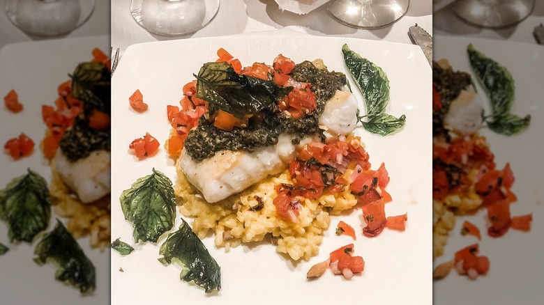 Halibut bruschetta  with diced tomatoes, and a pesto sauce layered over a risotto mixture from The Empire Bistro, Tiffin, Ohio