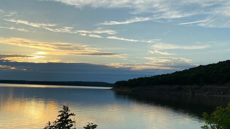 Sunset colors reflecting on Elk City Reservoir at Elk City State Park, Kansas