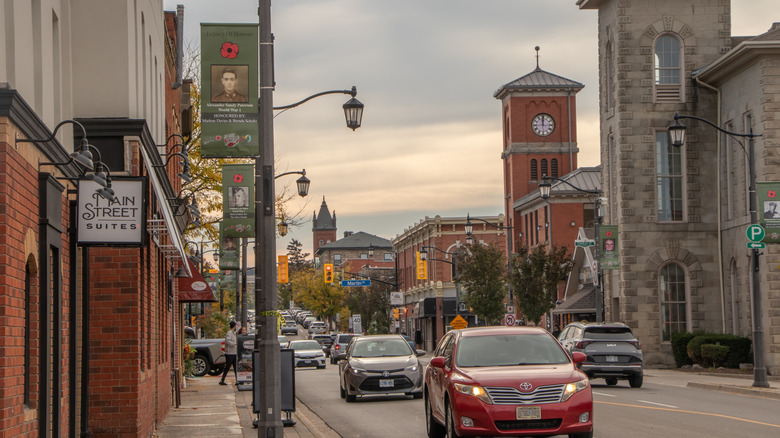 Historic brick buildings and local cars in Downtown Milton, Ontario.