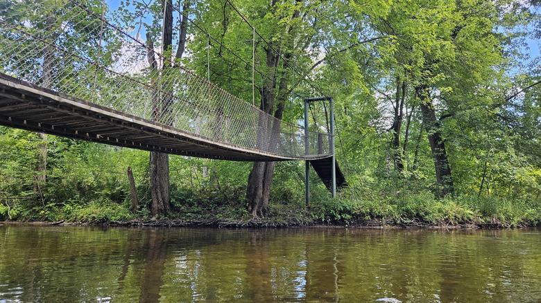 Swinging bridge over the Chippewa River at Deerfield Nature Park, Michigan