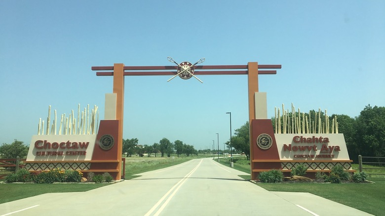 The entrance to the Choctaw Cultural Center, with writings in English and the Choctaw language