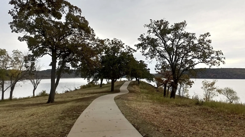 a paved trail winding through Sequoyah State Park, Oklahoma