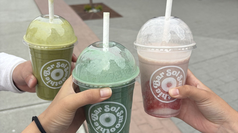 Shoppers holding smoothies from Sol Smoothie Bar in downtown Chilliwack, Canada