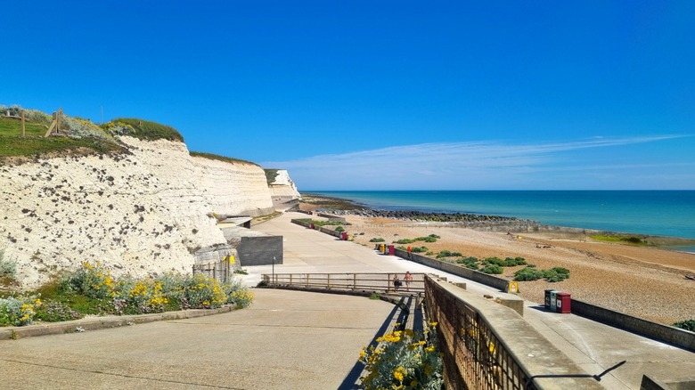 Undercliff Walk next white cliffs and beach, Saltdean, East Sussex, England