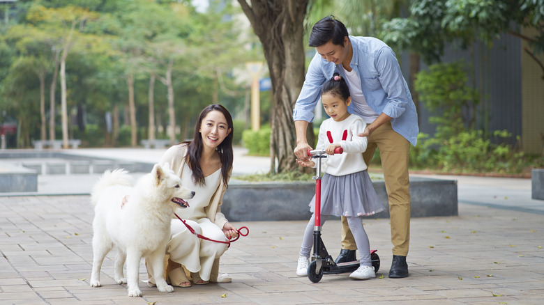 Asian family with a dog