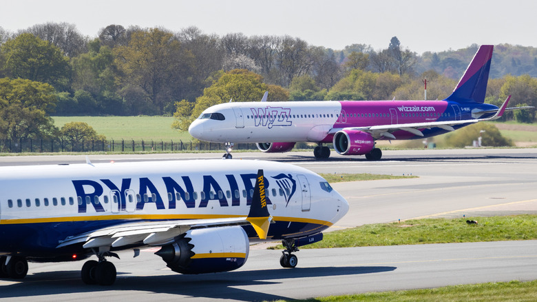 Boeing and Airbus planes, including Wizz Air A321 and Ryanair 737, at London Luton Airport