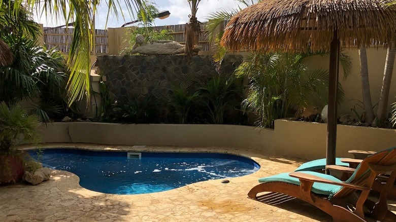 Private pool and lounges with rustic setting