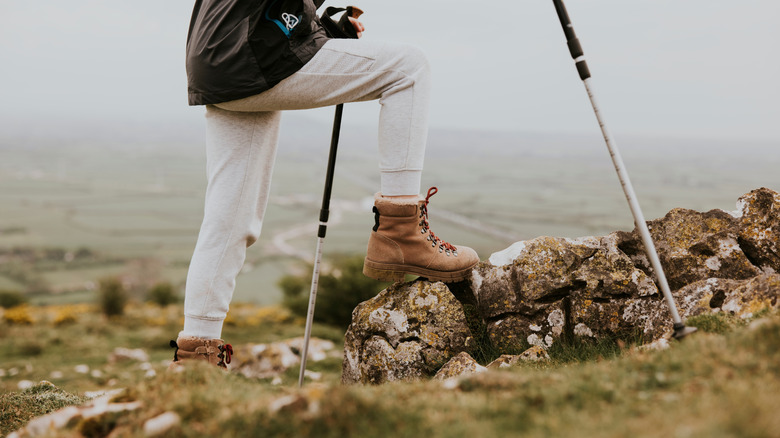 A person hiking with the camera focused on their shoes