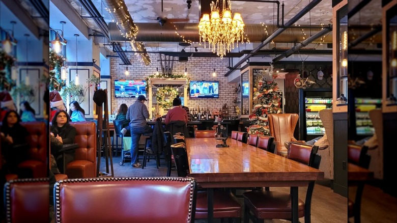 Interior of Tradesman Coffee Shop in Boston with an espresso machine and decorative carousel