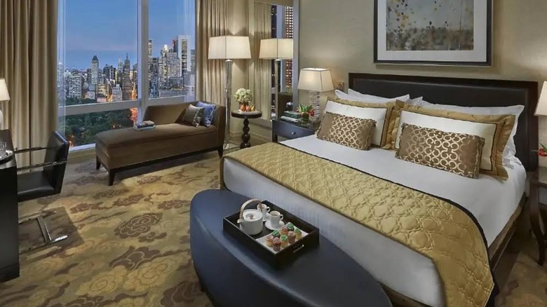 Hotel room with breakfast tray and Boston skyline at Mandarin Oriental Boston