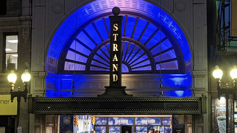 The colorful sign of the historic Strand Theatre during the evening in Dorchester