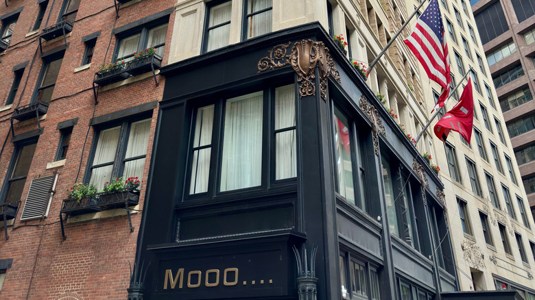 XV Beacon and Mooo.... building exterior with the American flag at the side in Beacon Hill, Boston