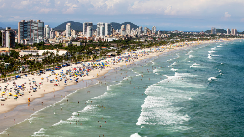Praia da Enseada with plenty of crowds in Guarujá, Brazil