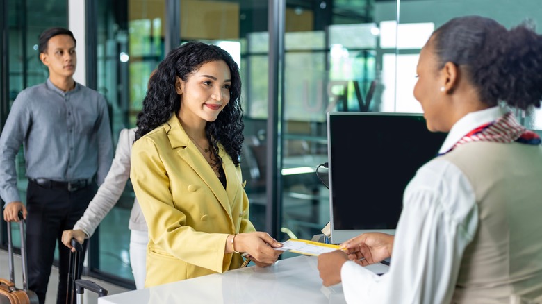 flight attendant at boarding gate