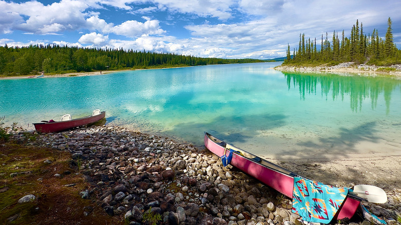 Canoes left on the shore at Boya Lake Provincial Park