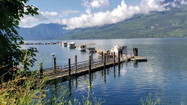 A dock on Upper Arrow Lake in Nakusp surrounded by mountains