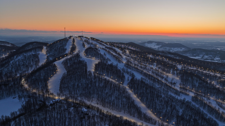 Bromont ski slopes illuminated at sunset