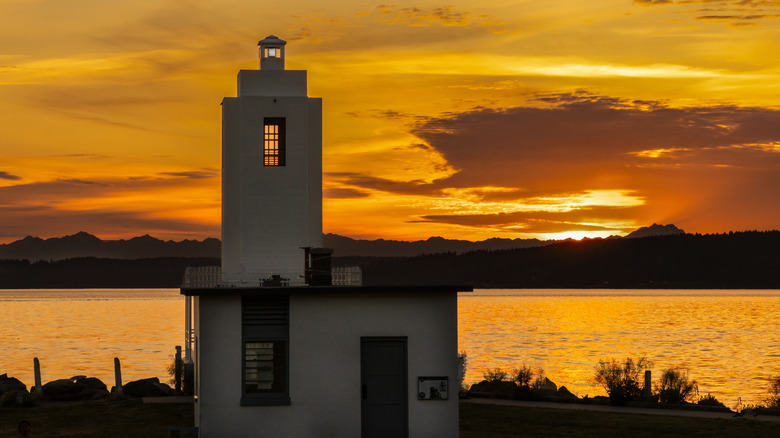 A golden sunset behind Browns Point Lighthouse.